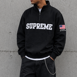 Black Supreme Half Zip Pullover from the United States Edition, showcasing the stylish design and premium fabric.