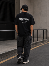 Black REPRESENT Owners Club Logo T-shirt featuring the brand's distinctive graphic on the front.