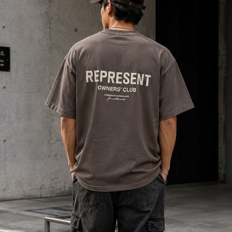 Represent Owners Club Logo Tee in fog color, featuring a front graphic of the brand's logo on a casual cotton T-shirt.