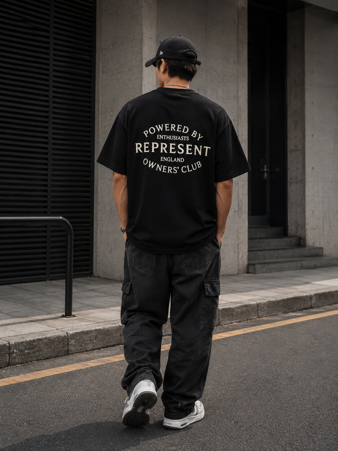 Black Represent Stamp Logo T-shirt featuring a prominent stamped logo design on the front.