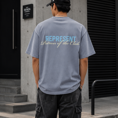 Represent Patron Of The Club grey T-shirt, casual apparel with graphic design, featuring the brand's logo on the front.