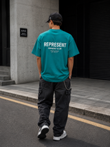 Teal Represent Owners Club Logo T-shirt featuring the brand's graphic design on the front.
