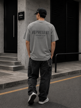 Represent Owners Club Logo Tee in ultimate grey, featuring a front graphic design and casual fit, perfect for streetwear style.