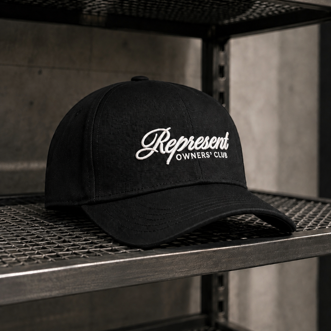 Black Represent Owners Script Logo Snapback cap, a stylish headwear with embroidered logo, adjustable brim, and classic snapback design.