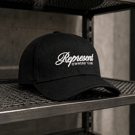 Black Represent Owners Script Logo Snapback cap, a stylish headwear with embroidered logo, adjustable brim, and classic snapback design.