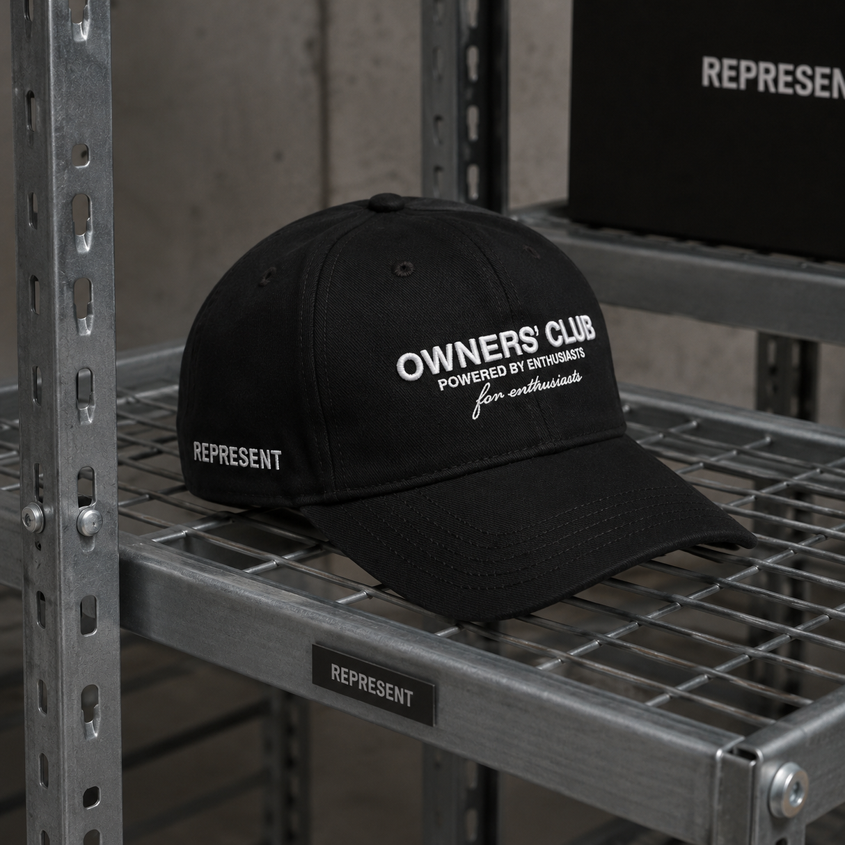 Black REPRESENT Owners Club Logo Snapback hat showing the front with the embroidered club logo and structured brim.