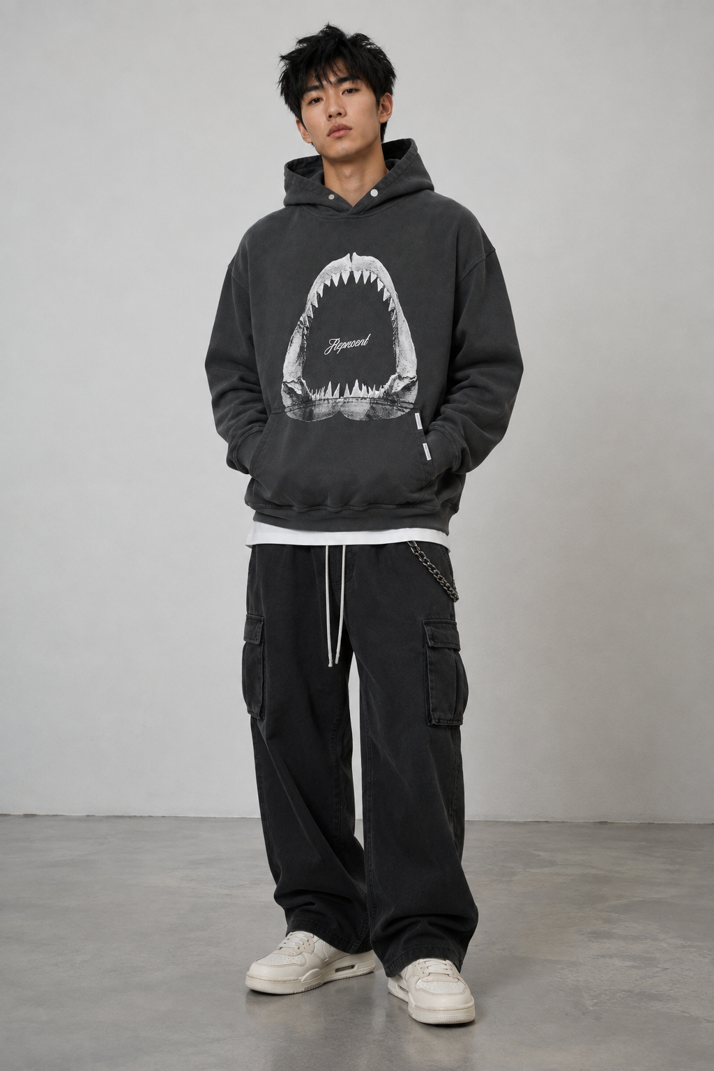 Represent Shark Jaws Hoodie in Off Black, featuring a bold shark graphic on the front, casual streetwear style, and comfortable fit.