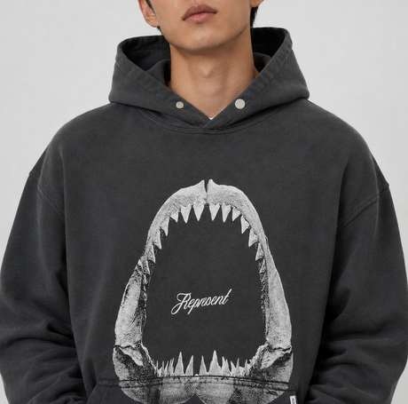 Represent Shark Jaws Hoodie Off Black, black hoodie featuring a shark jaw graphic, casual streetwear apparel from REPRESENT.