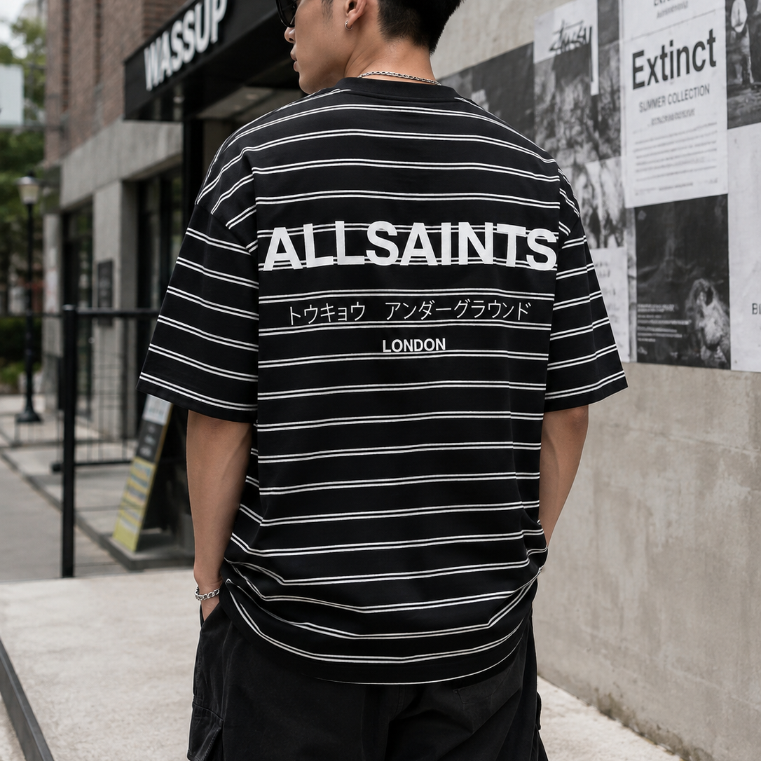 AllSaints Underground Logo striped black t-shirt with crew neck and short sleeves, featuring branding and bold striped pattern.