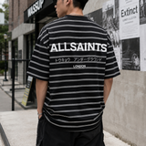 AllSaints Underground Logo striped black t-shirt with crew neck and short sleeves, featuring branding and bold striped pattern.