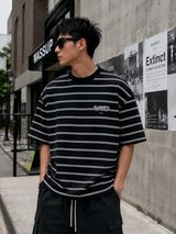 AllSaints Underground Logo Striped Black T-shirt featuring bold logo print and black and white striped pattern.