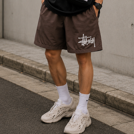 Stussy Basic Big Logo nylon shorts in brown with a large logo print, casual men's apparel for comfortable summer wear.
