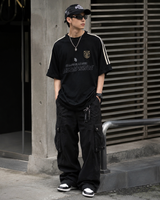 Black MasonPrince Millennium OV Raglan Tee featuring contrasting sleeves and a casual fit, modeled on a plain background.