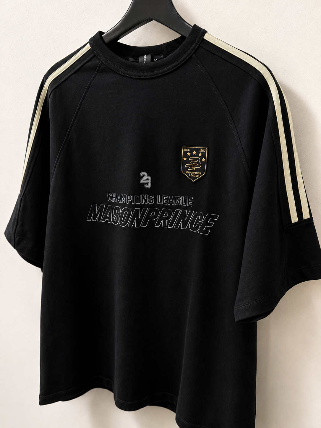 Black MasonPrince Millennium OV Raglan Tee, casual short-sleeve apparel with contrasting sleeves and logo detail.