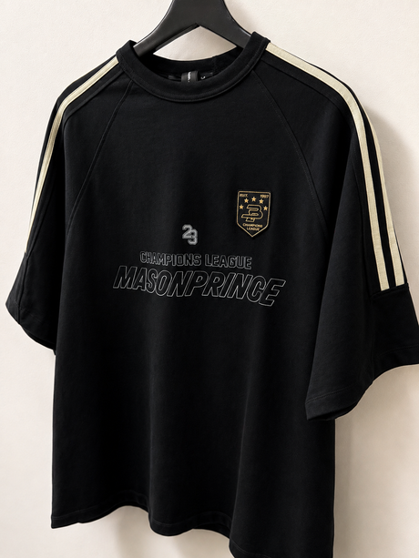 Black MasonPrince Millennium OV Raglan Tee, casual short-sleeve apparel with contrasting sleeves and logo detail.
