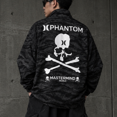 Mastermind Japan Phantom Woven Zip Up Jacket, stylish black accessory with zip closure, featuring intricate woven details and branding.
