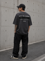 AllSaints Redact Strikeout Logo T-shirt in washed black, casual apparel with bold logo design, made from comfortable fabric.