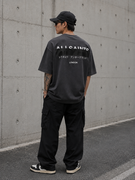 AllSaints Redact Strikeout Logo T-shirt in washed black, casual apparel with bold logo design, made from comfortable fabric.