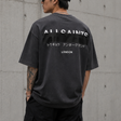 AllSaints Redact Strikeout Logo Tee in washed black, casual apparel with bold logo print on front.