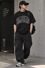 Cole Buxton Arch Logo Tee in vintage black, showcasing a classic crewneck t-shirt with the brand's logo design on the front.