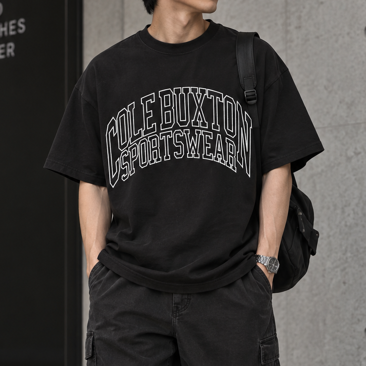 Cole Buxton vintage black tee with arch logo, casual apparel featuring minimalist design and comfortable fit.