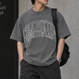 Cole Buxton Arch Logo Tee in washed black, casual apparel with a prominent logo design on the front.