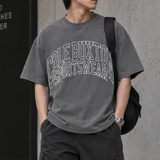 Cole Buxton Arch Logo Tee in washed black, casual apparel with a prominent logo design on the front.