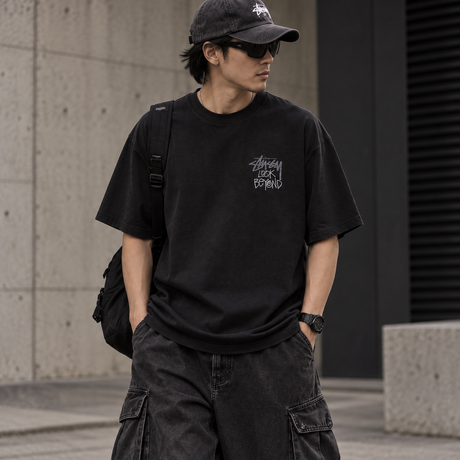 Black Stussy Look Beyond T-shirt featuring bold graphic design, casual fit, and classic streetwear style.