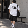 White Stussy Relax Tee shirt with a casual fit, displayed on a hanger, showcasing the relaxed style and soft cotton fabric.