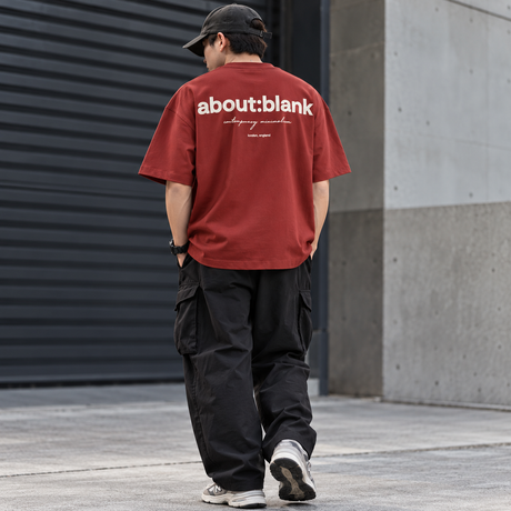 AboutBlank Box Logo Tee in wine color, casual apparel with a box logo front design, displayed on a hanger.