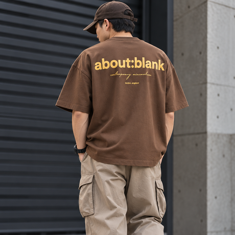 Brown ABOUT:BLANK Box Logo Tee shirt with black logo print on front, casual apparel for everyday wear.