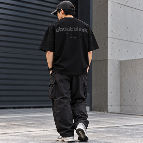 Black AboutBlank box logo T-shirt displayed flat, featuring a minimalist design with the brand's signature logo on the front.