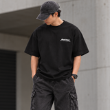 Black AboutBlank Zev Logo Tee shirt, casual apparel with graphic logo design, displayed on a flat surface.
