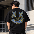 Black Rickyisclown Spark Leather Patch Tee shirt with RICKYISCLOWN branding and graphic design, front view.