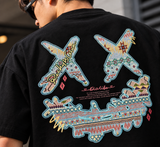 Black Rickyisclown Sky Tribal Embossed Tee featuring bold tribal patterns and textured embossed details, casual men's apparel.