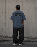 Boneless B Foam Logo Tee in grey and blue, casual apparel featuring a graphic logo on the front.
