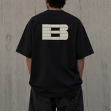 Black Boneless B Foam Logo Tee shirt from BONELESS apparel featuring a bold foam logo design on the front.