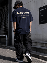 AllSaints Underground Logo Tee in MoonLit Blue, casual men's T-shirt featuring all-over logo print and crew neck design.