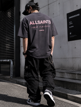 AllSaints Underground Logo Tee in washed black with pink accents, casual apparel featuring the AllSaints brand logo.