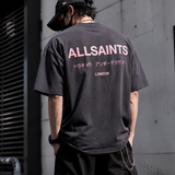 AllSaints Underground Logo Tee in washed black with pink logo print, casual men's apparel, front view of the T-shirt.