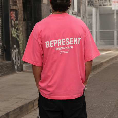 Represent Owners Club Logo Bubblegum Pink T-shirt featuring a printed logo design on the front.