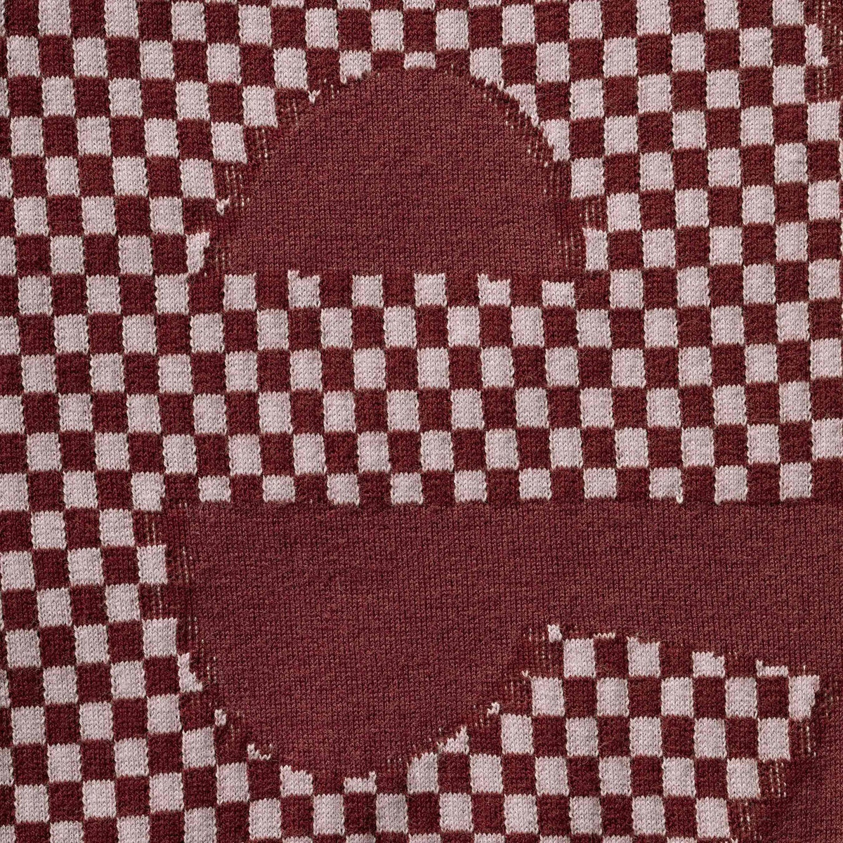 Supreme checkered burgundy intarsia tee shirt with bold checkered pattern and crew neckline, casual apparel for streetwear style
