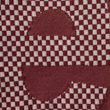 Supreme checkered burgundy intarsia tee shirt with bold checkered pattern and crew neckline, casual apparel for streetwear style
