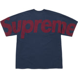 Supreme navy checkered intarsia t-shirt showing a bold checkered pattern and crew neckline, casual streetwear style.