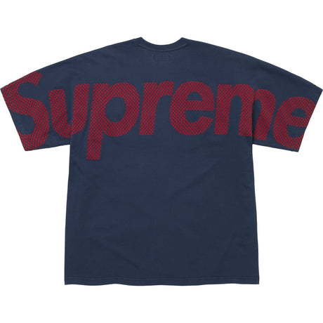 Supreme navy checkered intarsia t-shirt showing a bold checkered pattern and crew neckline, casual streetwear style.