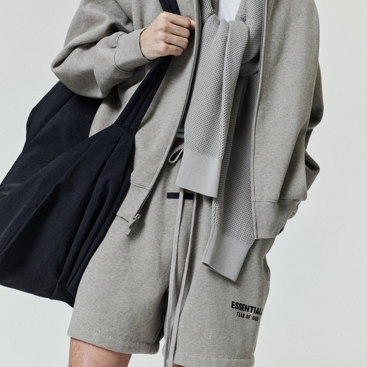 Fear Of God Essentials classic logo sweat shorts in Heather Homestead, featuring comfortable casual style and branded design.