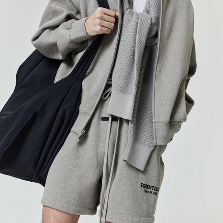 Fear Of God Essentials classic logo sweat shorts in Heather Homestead, featuring comfortable casual style and branded design.