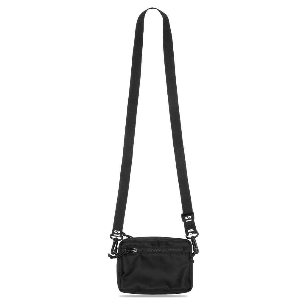 Black Human Made military mini sling bag with adjustable strap and compact pouch design, suitable for casual and outdoor use.