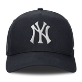 Structured AFRAME New York Yankees snapback cap by KAWS X Nike in navy with HUMAN MADE branding and Yankees logo.