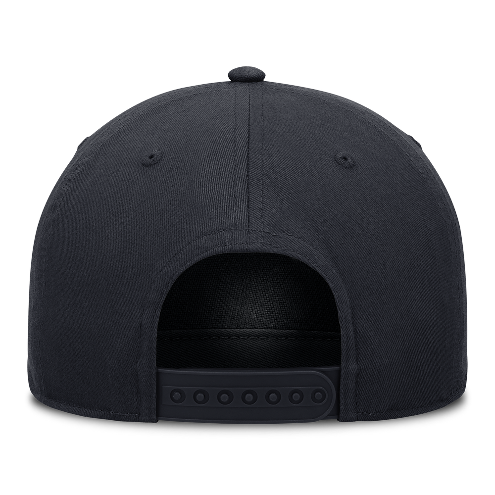 Human Made KAWS x Nike Yankees navy snapback cap with structured A-frame design and Yankees logo on front.